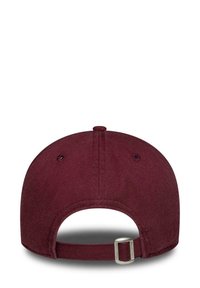 Maroon cap with a curved brim, made of fabric. Features a rear adjustable strap with a metal buckle and ventilation holes on the crown.