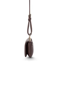 Brown leather shoulder bag with a rounded shape, smooth texture, and adjustable strap featuring a knotted detail and gold hardware accents.