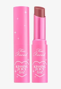Lip tint in pink tube with a rounded tip. Features silver accents and text: "Too Faced" and "KISSING JUICY tint." Smooth texture.