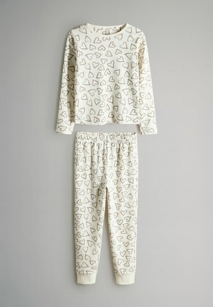 Børns pyjamas sæt med en langærmet top og bukser lavet af blødt bomuld, med cremet baggrund og brune hjerte mønster, elastisk talje.