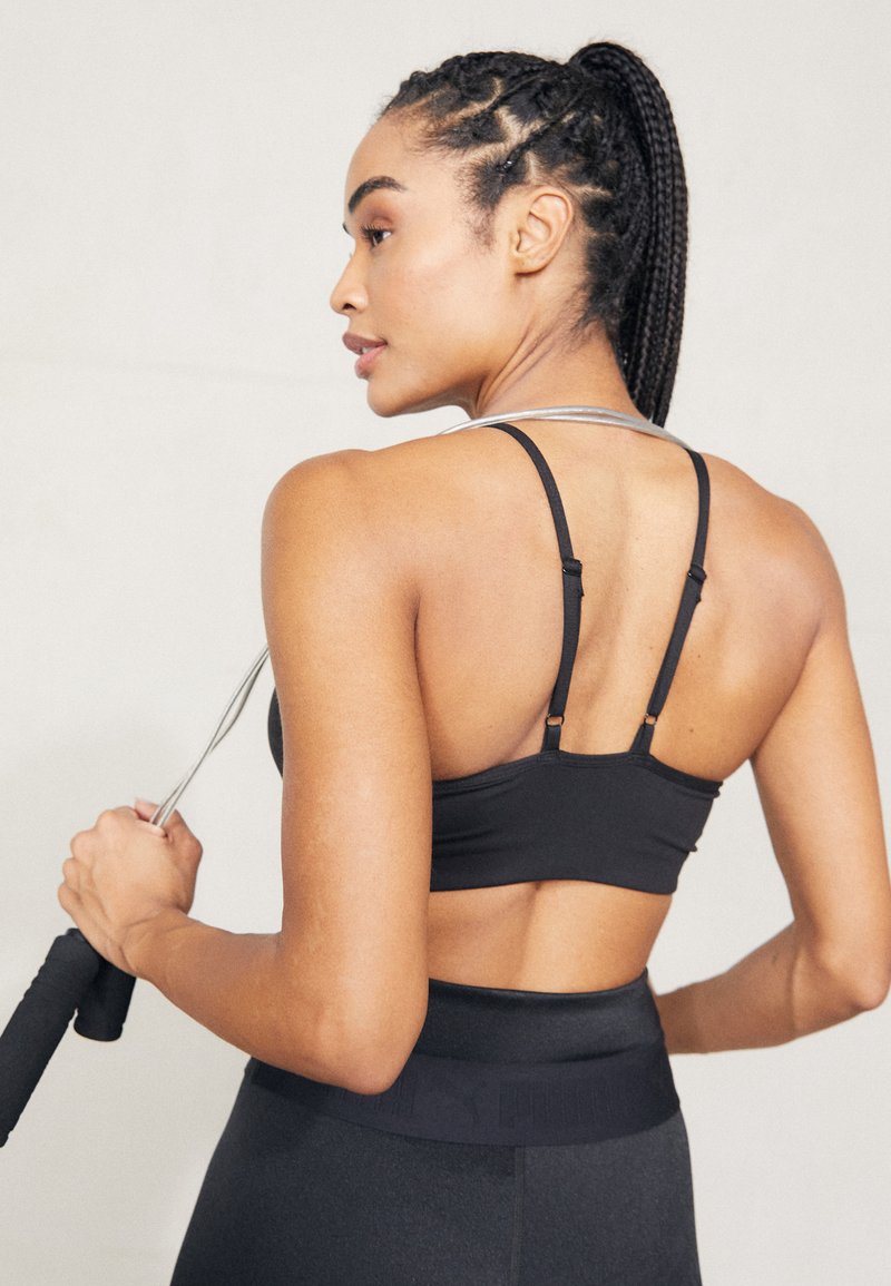 Puma MOVE YOGINI - Sportski grudnjak s blagom potporom - black
