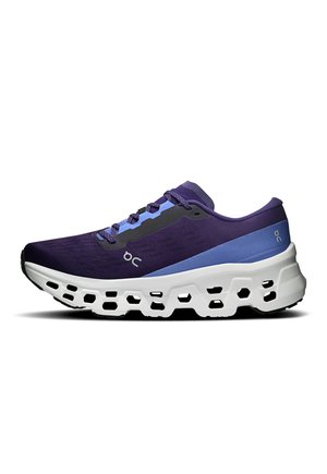 Purple and blue athletic shoe with ventilated white sole, side lacing, and small "oc" logo near the middle.