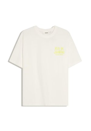 White short-sleeve T-shirt with "RIO DE JANEIRO" yellow text on the left chest and a round neckline.