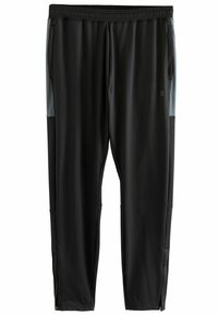 Pantalones deportivos negros con cintura elástica, bolsillos laterales y detalles grises. Textura suave, ajuste ceñido, con cremalleras en los puños de los tobillos.