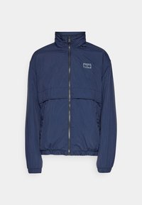 Marinblå vindjacka med hög krage, framficka med dragkedja, kontrasterande logotyp och elastiska manschetter, i ett slätt, lätt tyg.