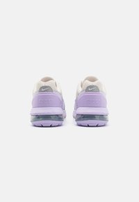 Purple and gray athletic shoes with mesh upper, padded collar, and transparent air cushioning sole. Features logo on heel and textured accents.