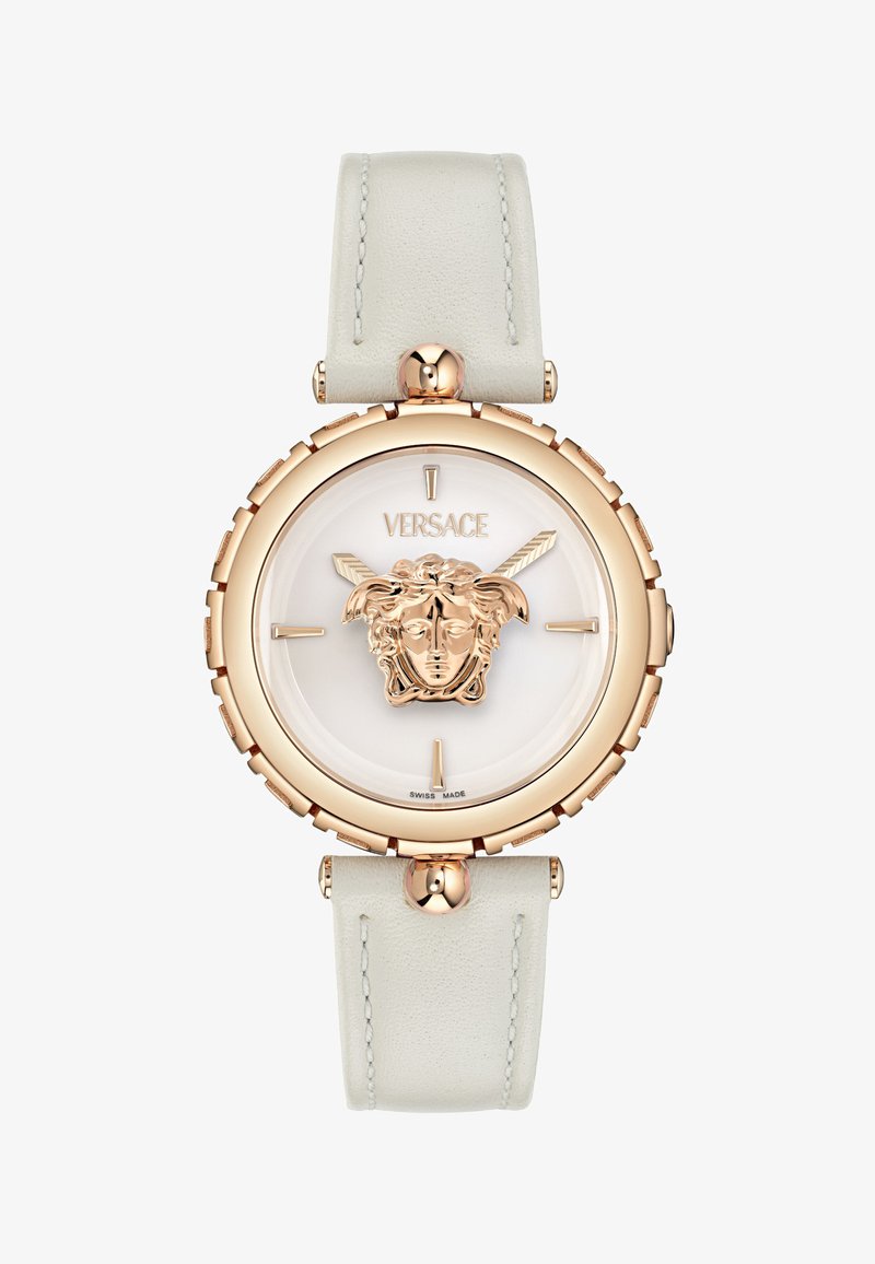 Versace pulkstenis ar apļa formā balto ciparnīcu, zeltītu Medusa logo, rozā zeltīta rāmja un teksturētas baltas ādas siksniņu.