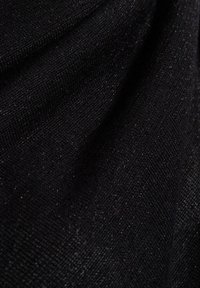 Black textured fabric with a subtle sheen, showcasing a tightly woven pattern and soft drape. Small sparkles visible throughout the surface.