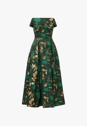 Off-the-shoulder, floor-length dress in dark green fabric with gold and teal floral patterns; structured bodice and flowing skirt.