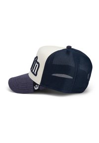 Navy and cream cap with a textured visor, mesh back, embroidered front detail, and a small logo patch on the side.