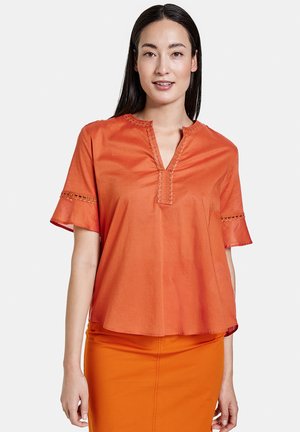 Blusa - burnt orange