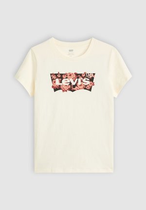 T-shirt en coton couleur crème avec un logo floral Levi's sur un fond sombre, manches courtes et col rond classique.