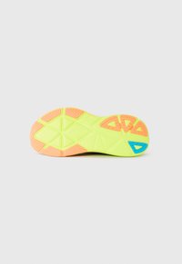 Shoe sole with a neon yellow base, featuring orange accents and a blue detail. Textured with a geometric tread pattern for traction.