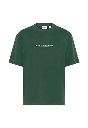 Dunkelgrünes T-Shirt mit kurzen Ärmeln und weißem Text "CORDONSPORT ATHLETICS 1986" zentriert auf der Vorderseite.