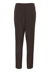 Dunkelbraune, elastische Hosen mit lockerer Passform. Glatte Textur, schmal zulaufende Beine und keine sichtbaren Taschen oder Verzierungen.