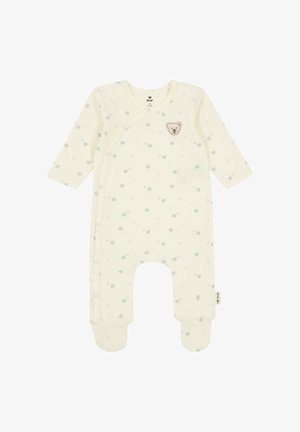 Crèmekleurig babyrompertje met lange mouwen, voetjes, een kleine groene klaverprint en een klein teddybeertje op de borst.