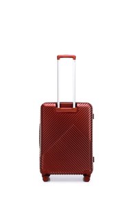 Red hard-shell suitcase with diagonal ribbed pattern, retractable aluminum handle, and four wheels for mobility. Compact rectangular design.
