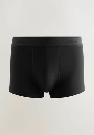 Mustad puuvillased boxer-püksid musta värviga, millel on ühtlane disain ja laiem vöökoht, millel on sisse pressitud "NEXT SIGNATURE". Sile tekstuur ja hästi istuv vorm.