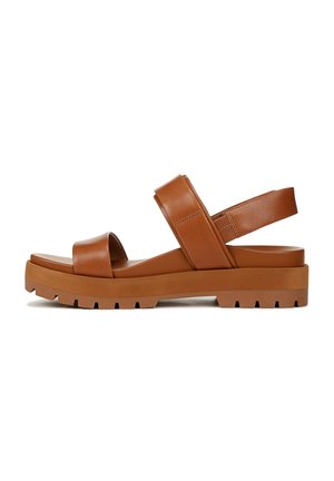 Brown leather sandal with wide straps, adjustable back, and a thick rubber sole featuring a textured pattern for traction.