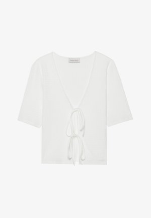 Weißes kurzärmliges Oberteil mit tiefem V-Ausschnitt, strukturiertem Stoff und einer Bindung an der Vorderseite. Etikett trägt "ANNA FIELD."