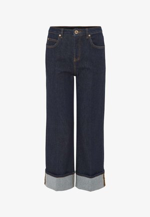 Donkerblauwe spijkerbroek met een losse pasvorm, voorzien van een omgeslagen zoom in lichtblauwe denim, contrasterende stiksels en zijzakken.