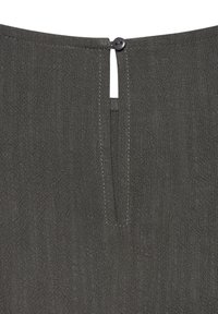Gray fabric detail featuring a small button closure at the back, with a vertical slit and fine stitching visible in the textile.