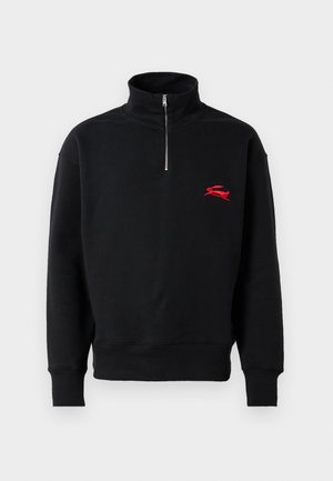 Black long-sleeve pullover sweatshirt with half zipper at neck and small red embroidered logo on left chest.