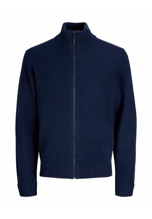 Navy zip-up neulepaita, joka on valmistettu pehmeästä kankaasta. Siinä on korkea kaulus, ribbaatut hihansuut ja helma sekä sileä pinta.