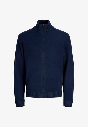 Navy zipsvārku džemperis, kas izgatavots no mīksta auduma, ar augstu apkakli, ribotām aprocēm un apakšmalu, kā arī gludu tekstūru.