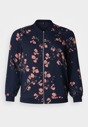 Navy bomber jacket featuring a floral pattern in pink and gray, with a front zipper, ribbed cuffs, and a round neckline.