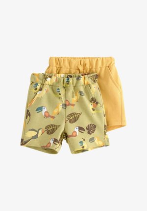 To par børne-elastikshorts med høj talje, den ene ensfarvet i sennepsgul og den anden grøn med tegneserie-tukan og bladprint.