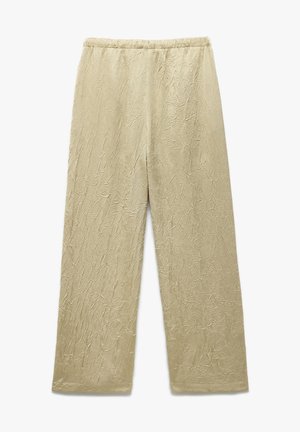 Lys beige, cropped bukser med tekstureret stof, der har et rynket mønster. Elastisk talje og bred ben-design for komfort.