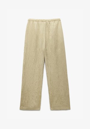 Hennotbeige, lyhytlahkeiset housut, joissa on tekstuuri ja ryppyinen kuvio. Joustava vyötärö ja leveä lahjemuotoilu mukavuutta varten.