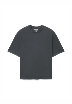T-shirt a taglio squadrato in grigio scuro, maniche corte, scollo rotondo, realizzata in cotone morbido, presenta una silhouette rilassata e dettagli di cuciture minimaliste.