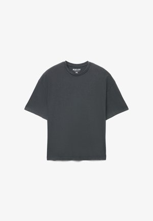 T-shirt a taglio squadrato in grigio scuro, maniche corte, scollo rotondo, realizzata in cotone morbido, presenta una silhouette rilassata e dettagli di cuciture minimaliste.