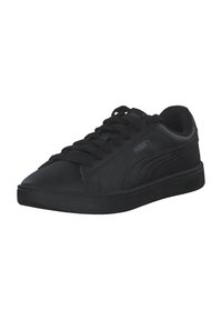 Zapatillas bajas negras de cuero liso con cordones planos, acentos laterales texturizados y suela de goma. Presenta un logo discreto.