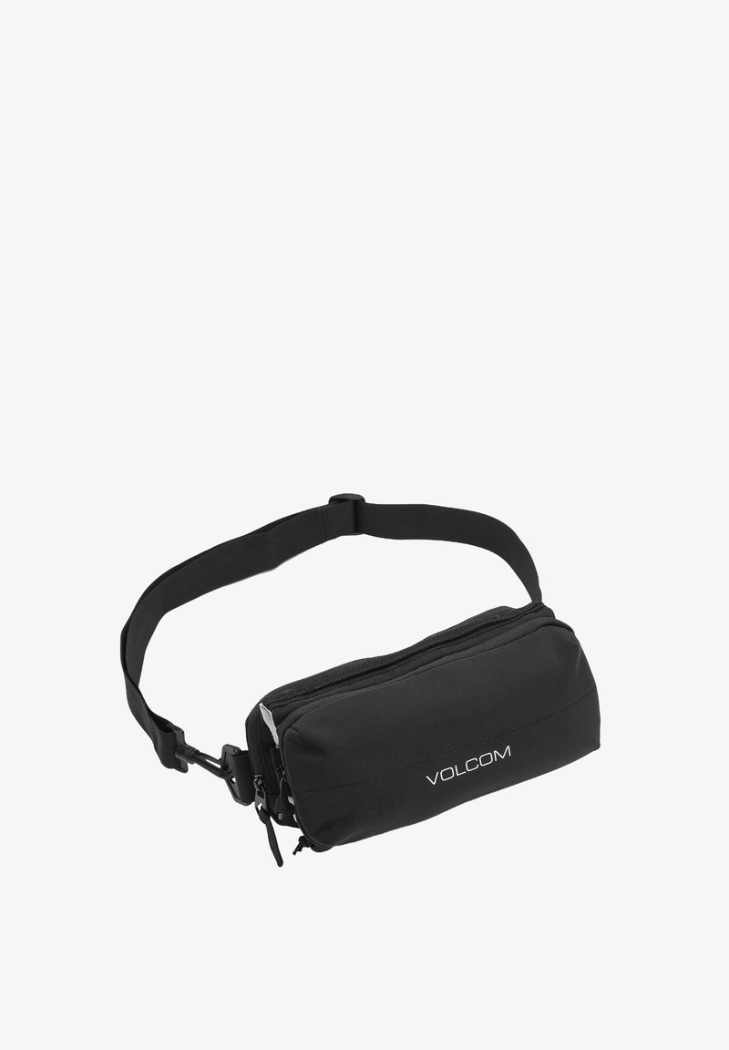 Sac à taille noir réglable avec deux compartiments zippés et logo "VOLCOM" blanc sur la poche avant.