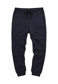 Granatowe dresy wykonane z miękkiego materiału, z elastyczną talią ze sznurkiem, bocznymi kieszeniami oraz ściągaczami na kostkach.