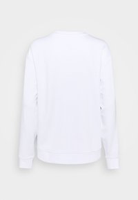 Felpa bianca a maniche lunghe realizzata in tessuto morbido. Presenta un collo rotondo, polsini e orlo a coste. Nessun motivo o dettaglio visibile.