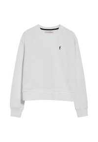 White sweatshirt with a crew neck, long sleeves, and ribbed cuffs, featuring a small black logo on the left chest. Soft fabric texture.