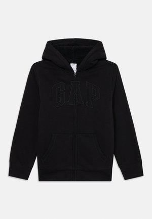 Black zip-up hoodie with front pockets, fleece-lined hood, and embossed "GAP" logo on the chest, laid flat on a white background.
