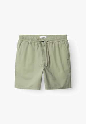 Svetlozelené šortky s elastickým pásom a nastaviteľnou šnúrkou. Majú textúrovanú látku s jemnými vzormi.