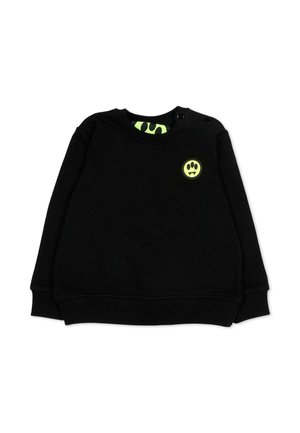 Zwart sweatshirt met lange mouwen en een neongeel vampieren-smiley-patch op de linkerborst, en bijpassende neondetails aan de binnenkant van de kraag.