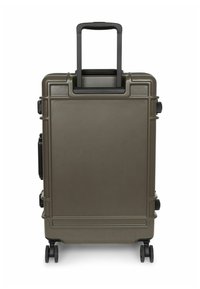 Hard-shell suitcase in olive green with a retractable black handle, two wheels, and multiple textured accents for stability and grip.