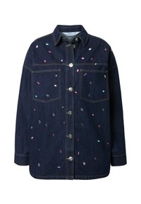 Spijkerjack met een knoopsluiting, twee borstzakken en kleurrijke paillettenversieringen verspreid over een donkerblauwe stof.