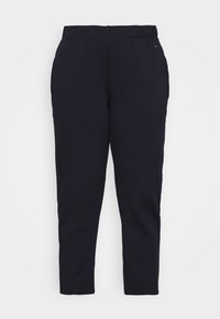Marineblauwe katoenmix joggingbroek met een elastische tailleband en taps toelopende pijpen. Gladde textuur, geen zichtbare patronen of hardware-details.