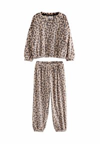 Beige ja musta leopardimustri loungekomplekt. Sisaldab laia lõikega pulloverit elastsete mansettidega ja sobivaid kitsenevaid pükse elastse vöökohaga.