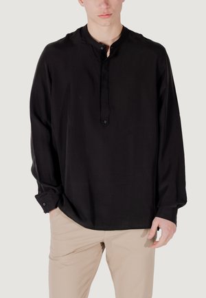 Black long-sleeve shirt with a buttoned henley neckline, made of smooth fabric. Features single button cuffs and a relaxed silhouette.