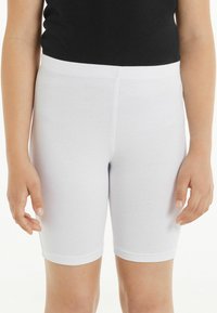 Shorts da bici in cotone elasticizzato bianco, con vita elasticizzata, design aderente e trama liscia, che arrivano a metà coscia.