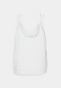 Witte mouwloze top met dunne bandjes, ronde halslijn en een losse pasvorm. Zachte stof met een gladde textuur. De zoom is netjes afgewerkt.